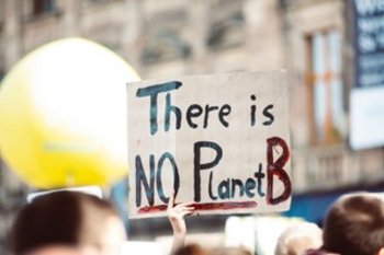 Person holding up sign at demonstration "There is no PlanetB"